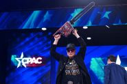 Musk With a Chainsaw on Stage Before American Conservatives