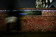 London Wall Illuminates Covid's Enduring Pain at Christmas