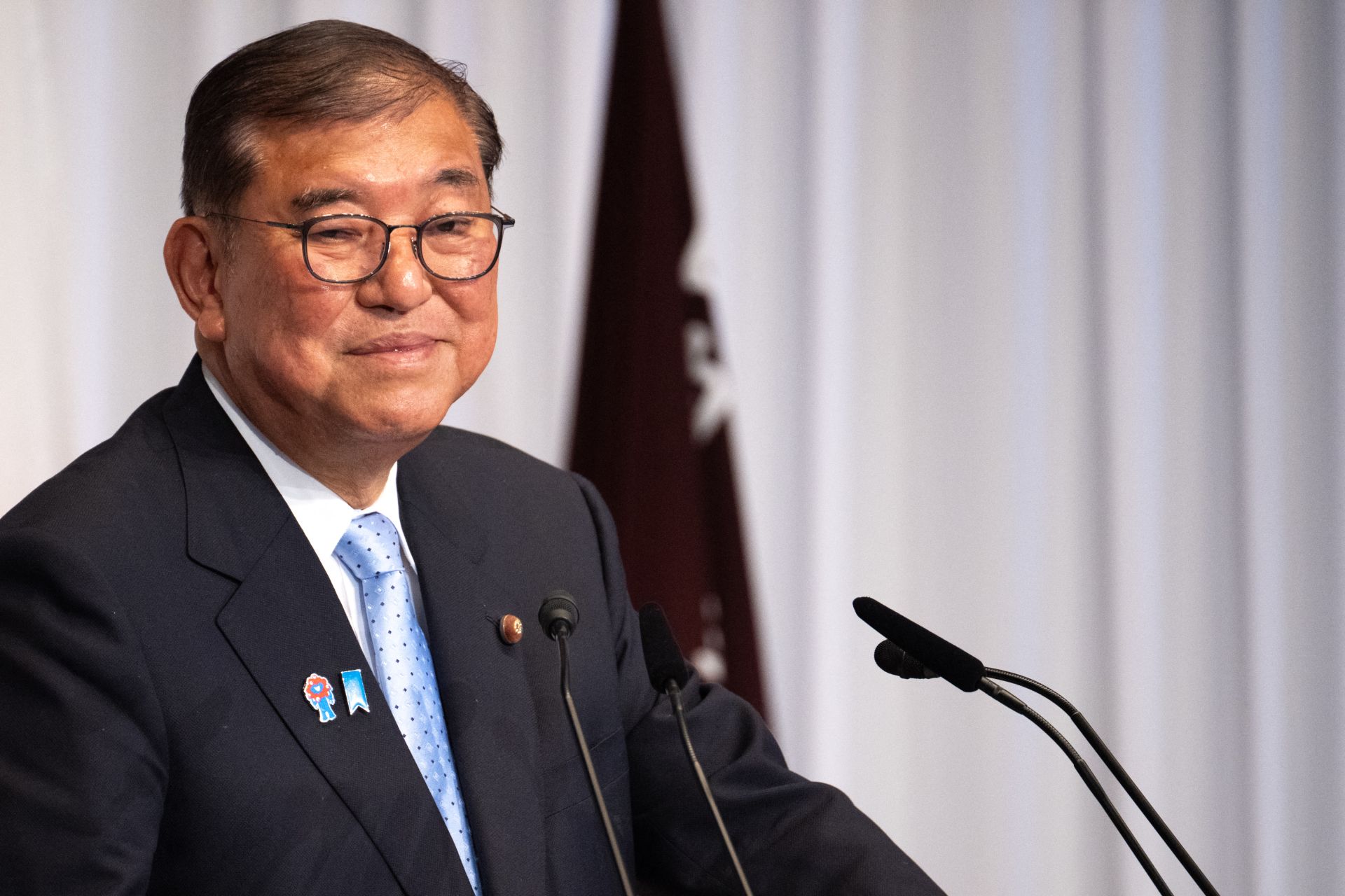 Japan PM Hangs on After Election Debacle