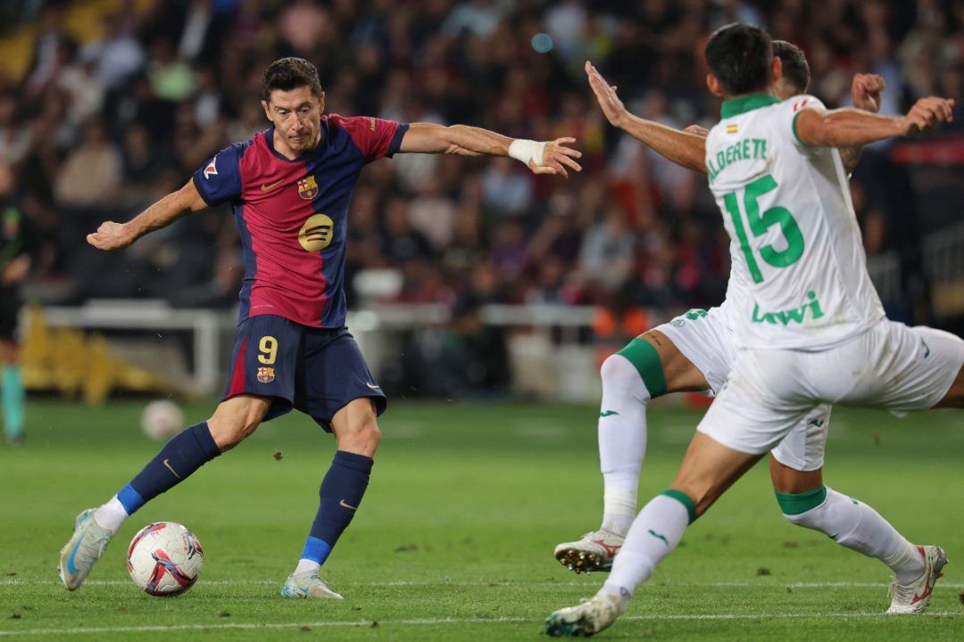 Lewandowski Helps Liga Leaders Barca Past Getafe