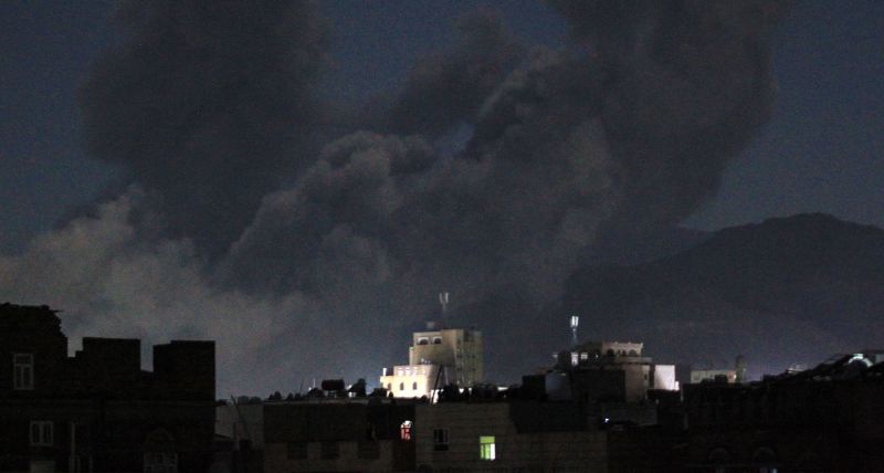 A plume of smoke billows during a US strike on Yemen's Huthi-held capital Sanaa early on March 16, 2025. The first US strikes against Yemen's Huthis since President Donald Trump took office in January killed at least 31 people, the rebels said on March 16, as Washington warned Iran to stop backing the group. (Photo by Mohammed Huwais / AFP)