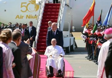 Pope Francis (C) is greeted upon his arrival at Presidente Nicolau Lobato International Airport in Dili on September 9, 2024. Pope Francis arrived on September 9 in predominantly Catholic East Timor for the third stop of an Asia-Pacific tour, the longest of the 87-year-old's papacy, according to an AFP reporter travelling with him.